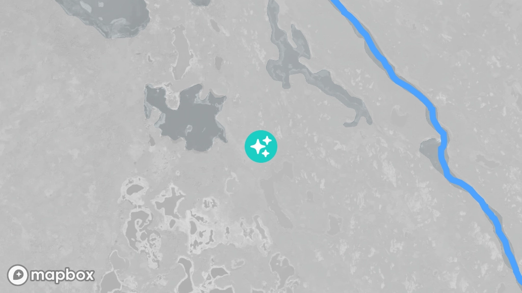 A satellite image of a located a few hundred meters inland from the shore of the Marian River.