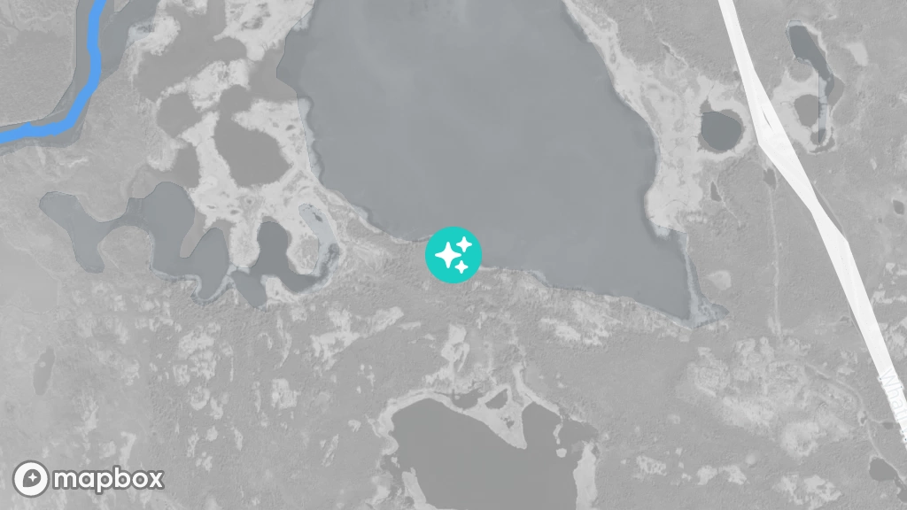 A satellite image of an old cabin located on shore of a small lake near the Marian River.